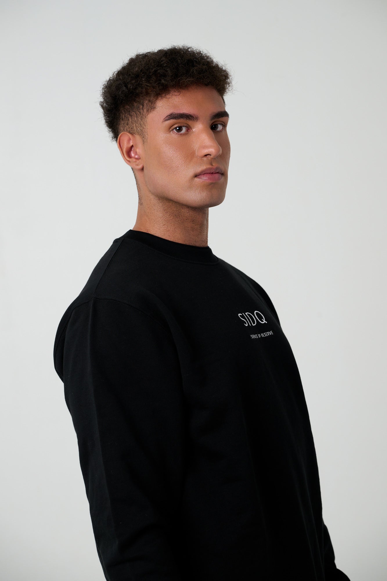 SIDQ ESSENCE OF RESERVE - Emblema