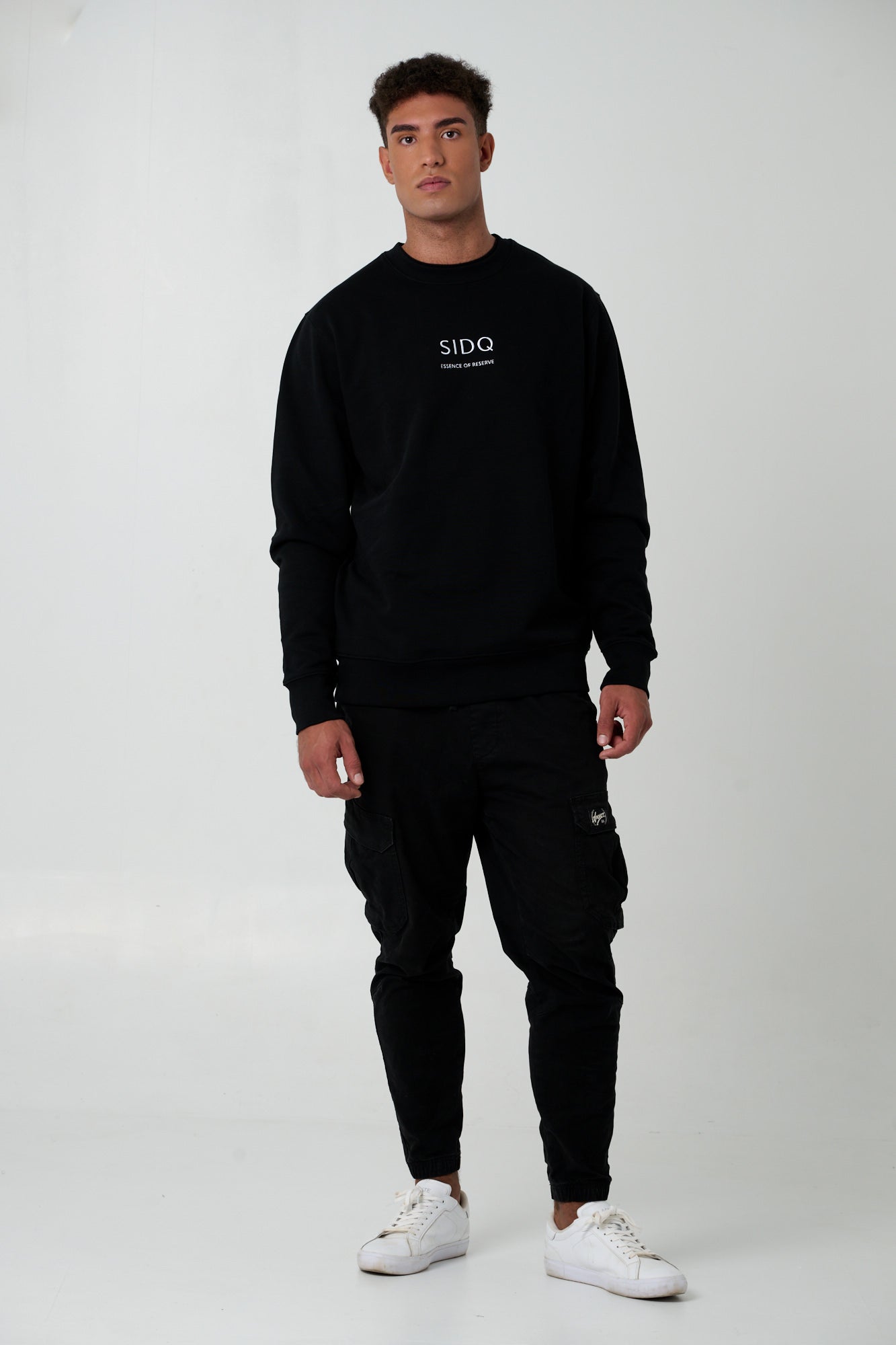 SIDQ ESSENCE OF RESERVE - Emblema